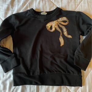 J Crew black sweatshirt with sparkly gold bow. Size 4-5. Smoke free.